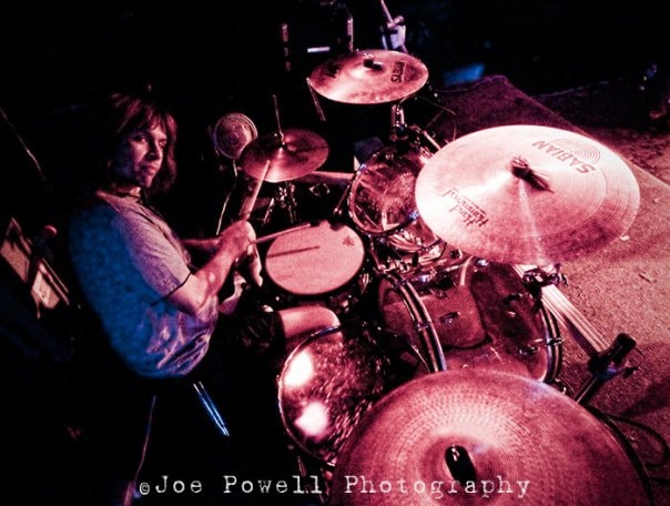 Anthony performing live on drums